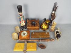 A mixed lot to include soapstone carving of a scholar, wooden carvings, barometer and similar.