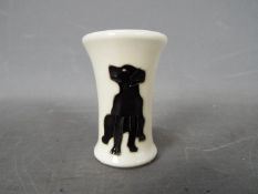 Moorcroft - a Moorcroft black Labrador vase,