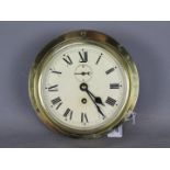 A mid 20th century brass cased ships bulkhead clock, Roman numerals,