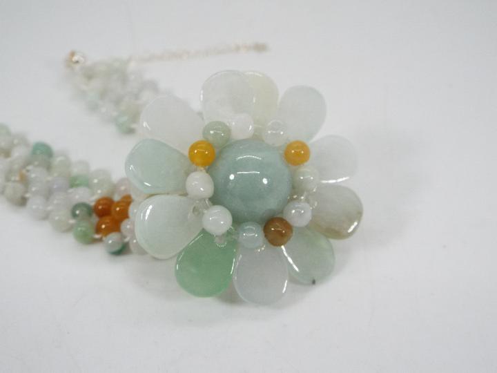 A 121 ct Burmese Natural Jadeite 'Colours of Paradise' flower bracelet set with silver, - Image 4 of 6