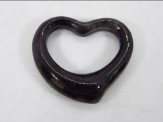 A 10 ct Type A Black Jadeite 'Heart of the Hwe' pendant issued in a limited edition 1 of 484,