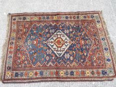 A traditional Indian style carpet, approximately 120 cm x 160 cm.