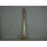 A brass cased marine stick barometer, the silvered dial marked Russell Norwich,