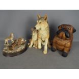 Country Artists - A large figural group depicting a wolf and cub entitled Safe Haven,