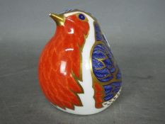 Royal Crown Derby - a paperweight depicting a Robin with gold stopper,