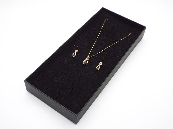 A 9ct gold, diamond and sapphire jewellery set comprising pendant on fine link chain, stamped 375, - Image 5 of 5