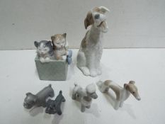 Six Nao Ceramic Figures. Dogs and Cats. Tallest is 17cm high.