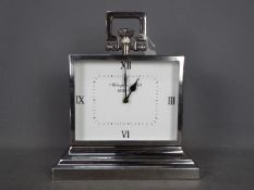 A Mclaughlin & Scott chrome plated mantel clock of large scale, approximately 38 cm (h).