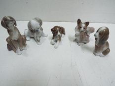 Lladro - Five Dog Ceramic Figures. Tallest is 11cm high.
