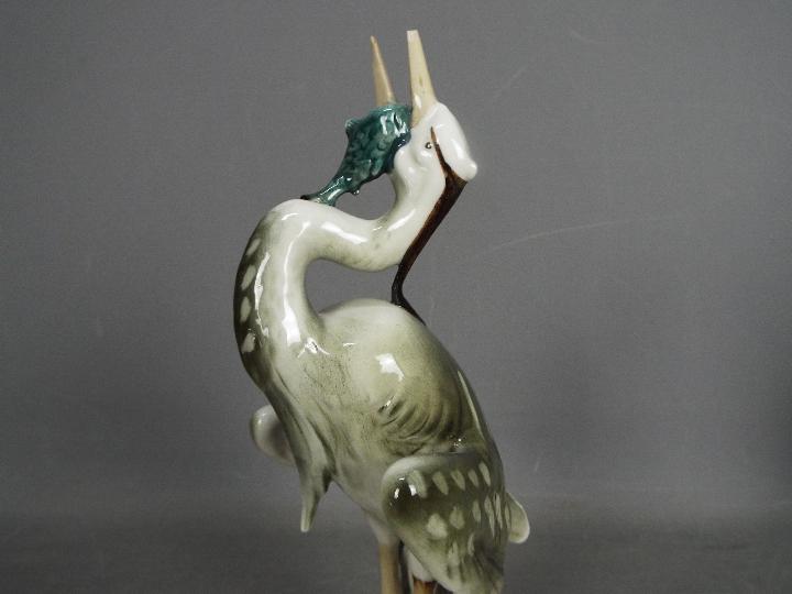 Royal Dux - Two bird figurines comprising a feeding heron and a peahen (one leg detached but - Image 3 of 11