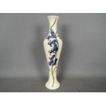Moorcroft - a ceramic vase by Moorcroft decorated in the Bluebell pattern,