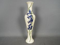Moorcroft - a ceramic vase by Moorcroft decorated in the Bluebell pattern,