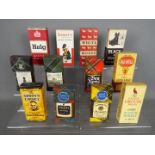 Twelve whisky miniatures in card sleeves comprising Famous Grouse 70° proof, Old Mull 70° proof,