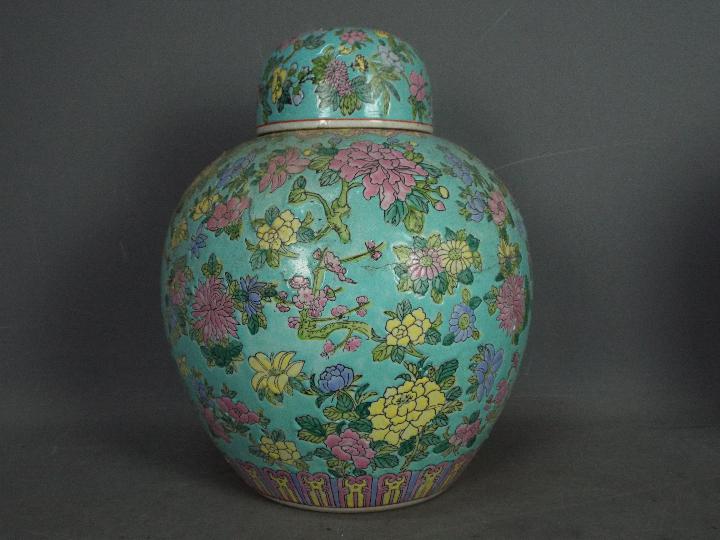 A large ginger jar and cover with floral decoration against a turquoise ground, - Image 2 of 11