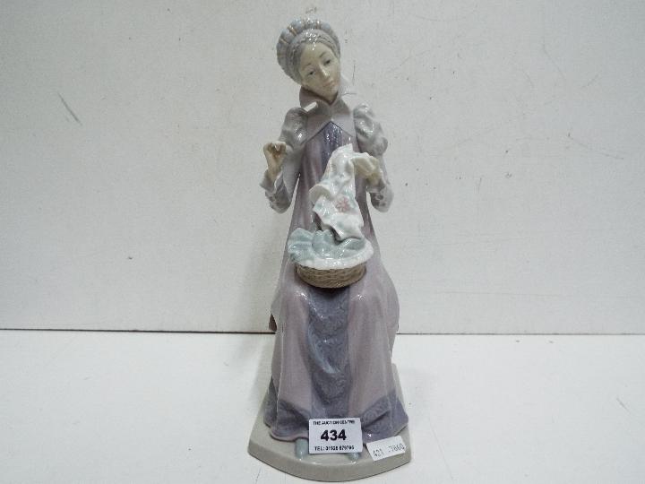 Lladro Large Lady figure. Impressed mark G-18 F. 30cm high.