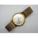 An 18ct gold cased Walker & Hall ultra slim wristwatch, the case back marked 2502G,