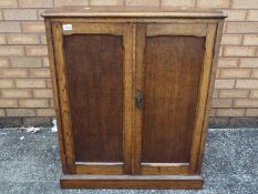 A small twin door cupboard, approximately 86 cm x 72 cm x 35 cm.