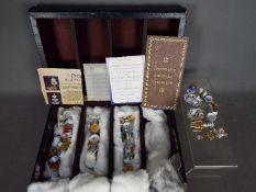 Mayfair Collection - A quantity of blue and white Dresden miniatures contained in a faux book