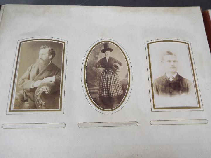 A late 19th century embossed leather photograph album with photographs, - Image 5 of 9