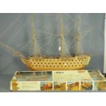 A large, kit built, wooden model of HMS Victory by Mantua Models, housed on a display stand,