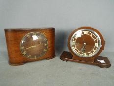 An Art Deco mantel clock and a Time Savings coin operated clock in Art Deco style case.