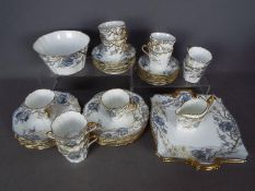 A quantity of early 20th century Wedgwood tea wares decorated with butterflies amongst flora with