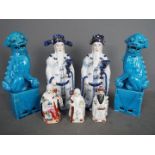 A group of ceramics to include a pair of blue glaze guardian lions (25 cm height) and Sanxing