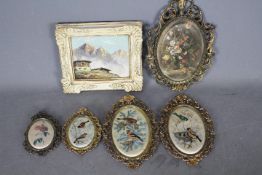 A collection of ornately framed Italian silk prints and a small oil on board Alpine landscape scene.