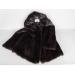 A Finnish Saga Mink fur jacket in a dark chocolate brown colour, slip pockets,