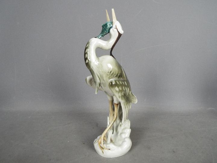 Royal Dux - Two bird figurines comprising a feeding heron and a peahen (one leg detached but - Image 2 of 11