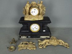 Two clocks for repair comprising one black marble and one figural brass.