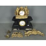 Two clocks for repair comprising one black marble and one figural brass.