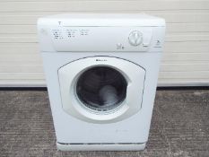 A Hotpoint Aquarius tumble dryer, model TVM570P.