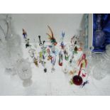 Coloured and crystal clear glass collection. Including merry go round and bird cage.