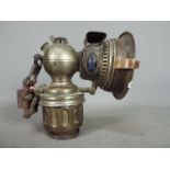 An early 20th century Miller's Monarch motorcycle head lamp.