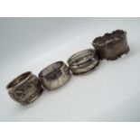 Three hallmarked silver napkin rings,