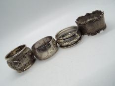 Three hallmarked silver napkin rings,