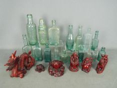 Lot to include vintage bottles and a quantity of cinnabar lacquer style figures and ornaments.