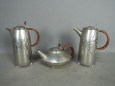 Archibald Knox for Liberty & Co - Three pieces of Tudric comprising coffee pot,