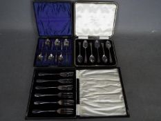 A cased set of George V hallmarked silver pastry forks, Birmingham assay 1927,