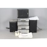 A Denon component music system, model D-110 comprising Pre-Main Amplifier, AM/FM Tuner,