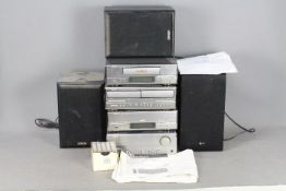 A Denon component music system, model D-110 comprising Pre-Main Amplifier, AM/FM Tuner,