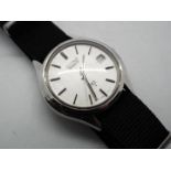 A vintage Seiko watch with material strap