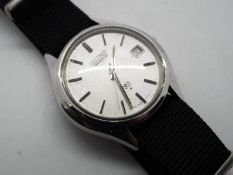 A vintage Seiko watch with material strap