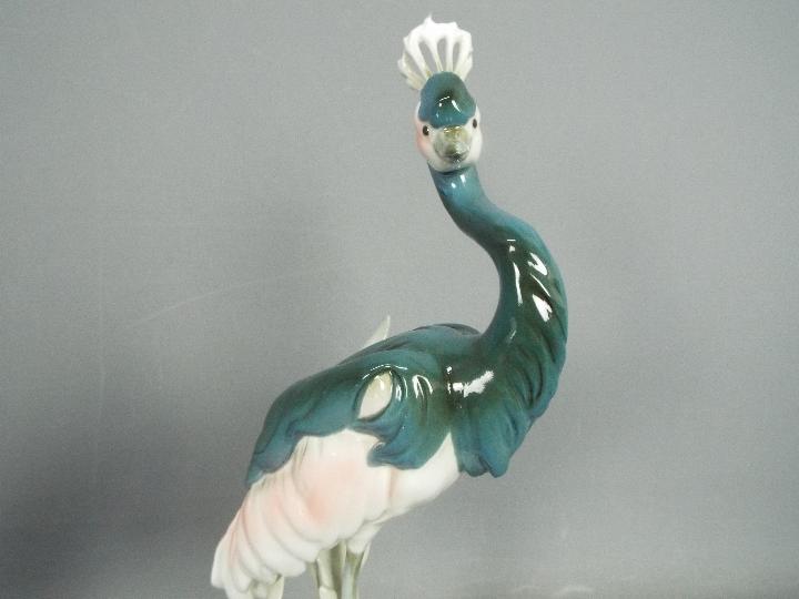 Royal Dux - Two bird figurines comprising a feeding heron and a peahen (one leg detached but - Image 8 of 11