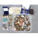 A collection of coins and a small quantity of banknotes,