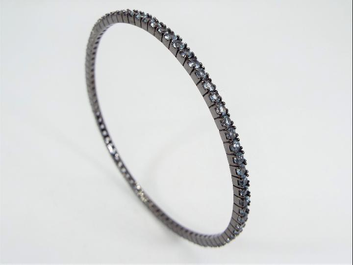 A 5.50ct Sky Blue Topaz and Silver bangle, issued in a limited edition 1 of 226, made up of 80 2. - Image 3 of 6
