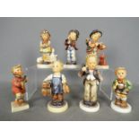 Seven Hummel figurines to include Boy With Telephone, Boy With Violin, Boy With Trumpet,