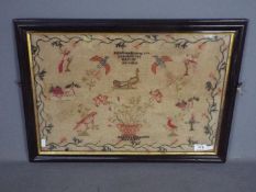 An early 19th century needlework sampler incorporating biblical verse, birds and butterflies,