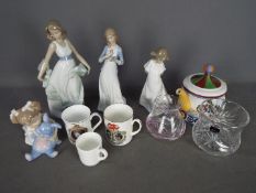 A mixed lot to include four Nao figurines, Caithness vase, Royal Doulton vase, teapot and similar.